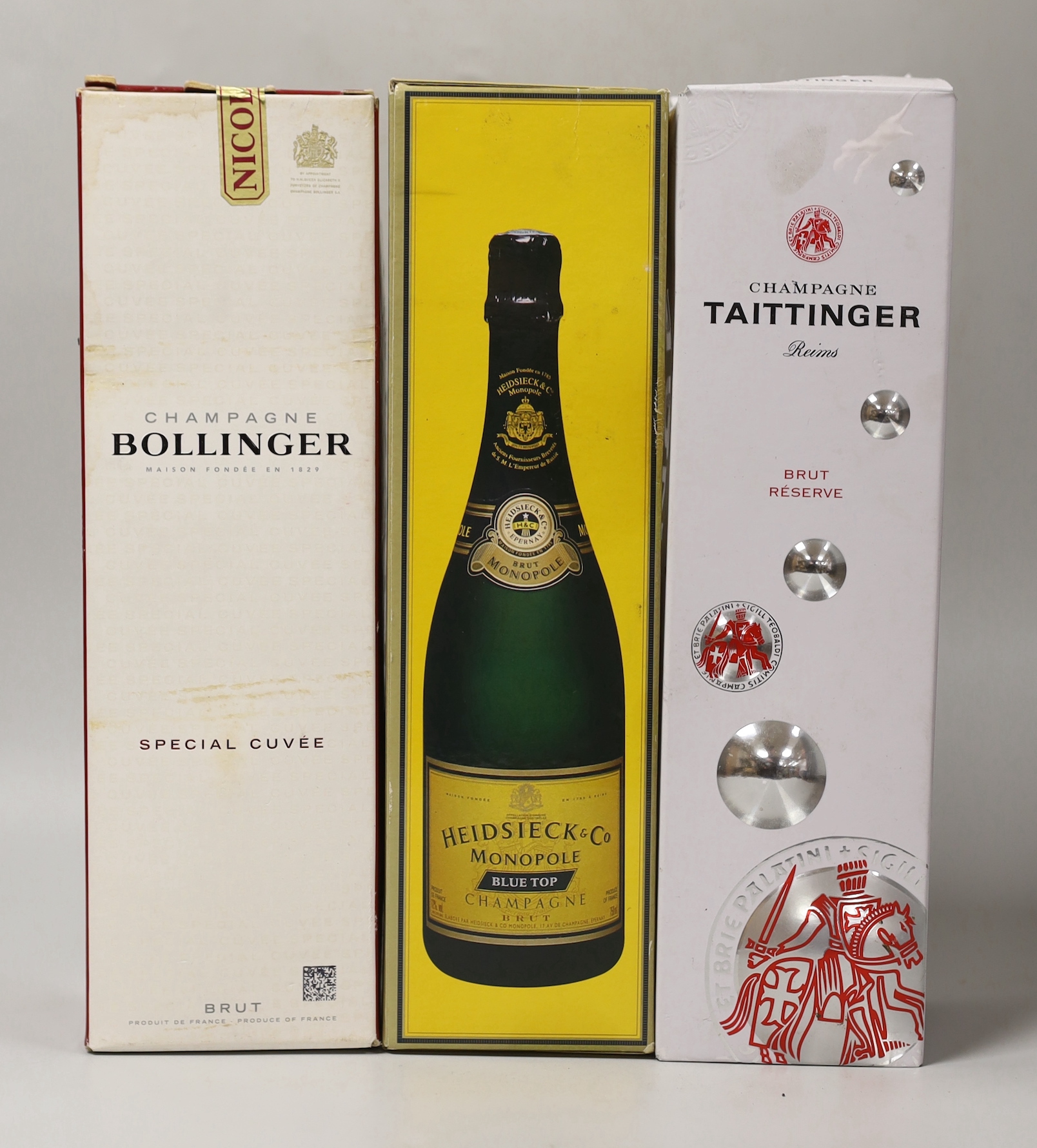 Three bottles of boxed champagne: Special Cuvee Brut Bollinger, Tattinger and Heidsieck and Co Monople